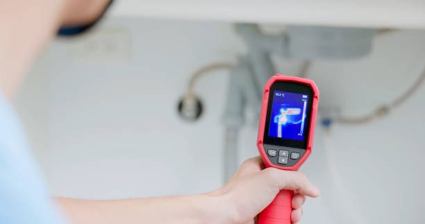 Person using thermal camera on sink.